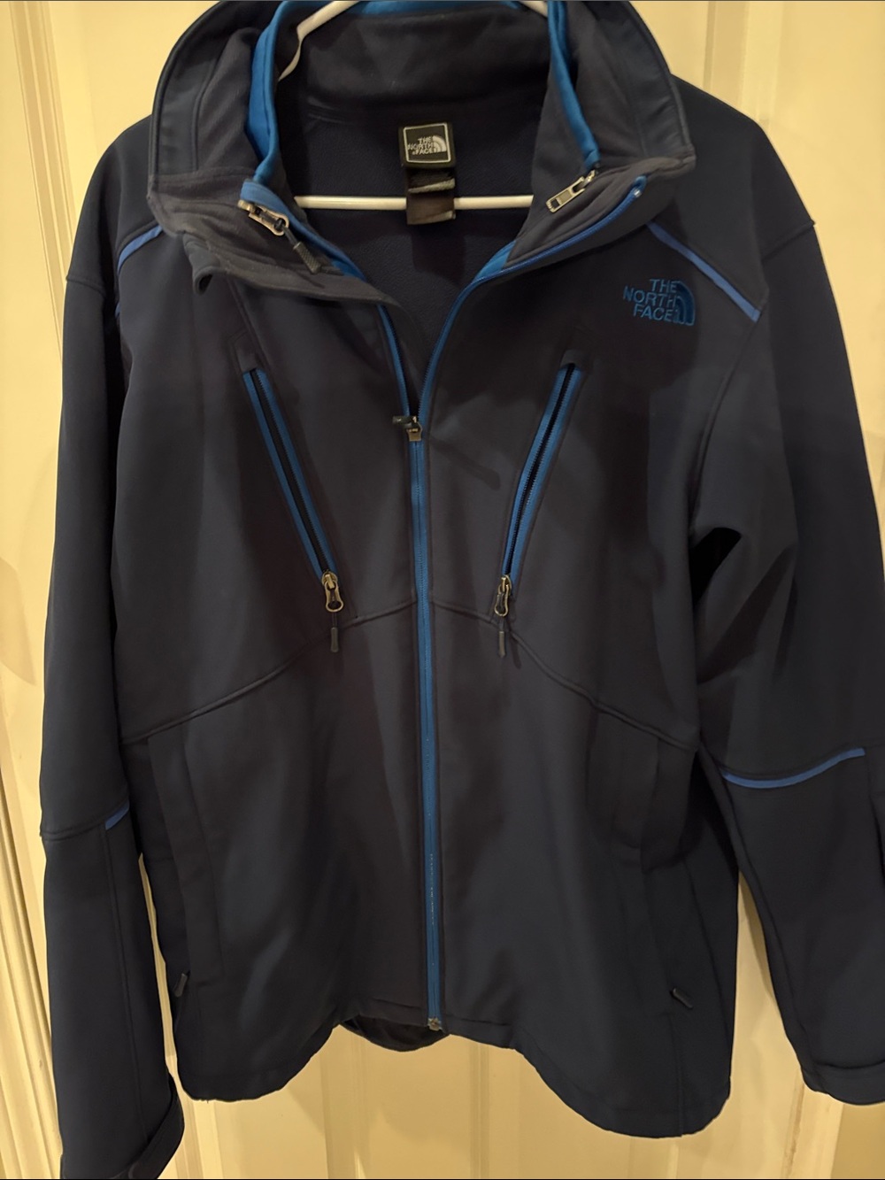 The North Face Men’s Navy Blue winter coat with a zip out zippered jacket-medium
